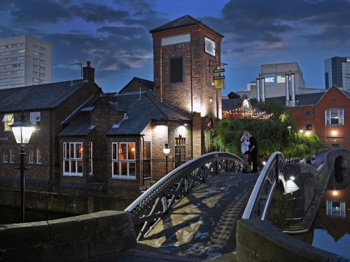 Walk bridge over the canal in evening. Birmingham (UK)
