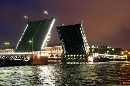 Palace bridge in raised position at night. St Peterburg (Russia)
