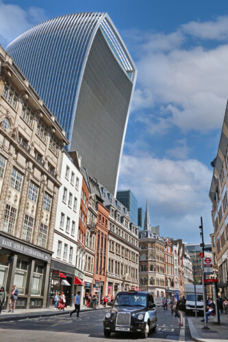 The Sky Garden skyscraper over historic houses in London.